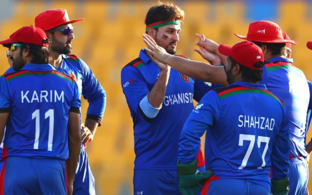 Afghan players celebrate after taking a wicket.
